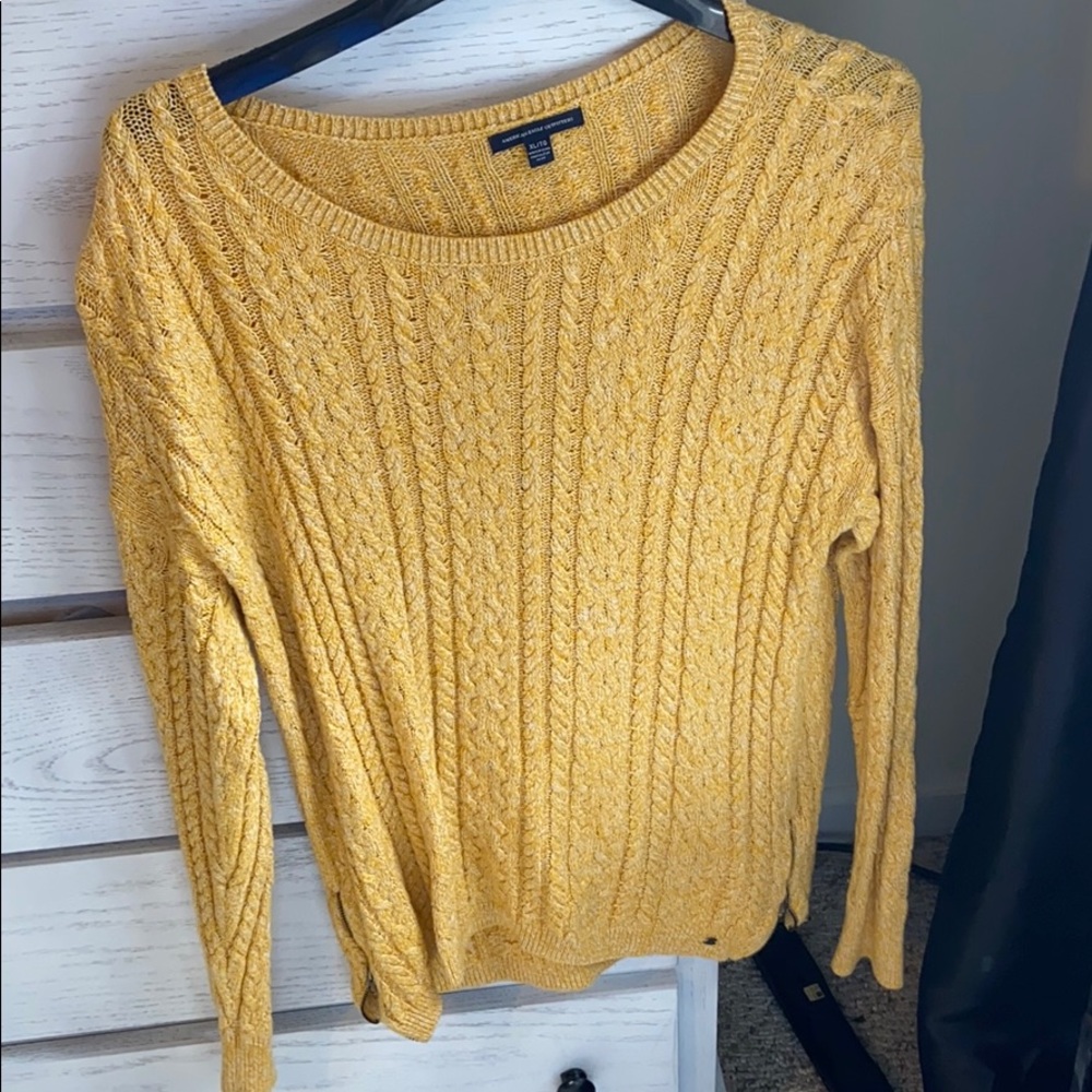 Gold long sleeve sweater.